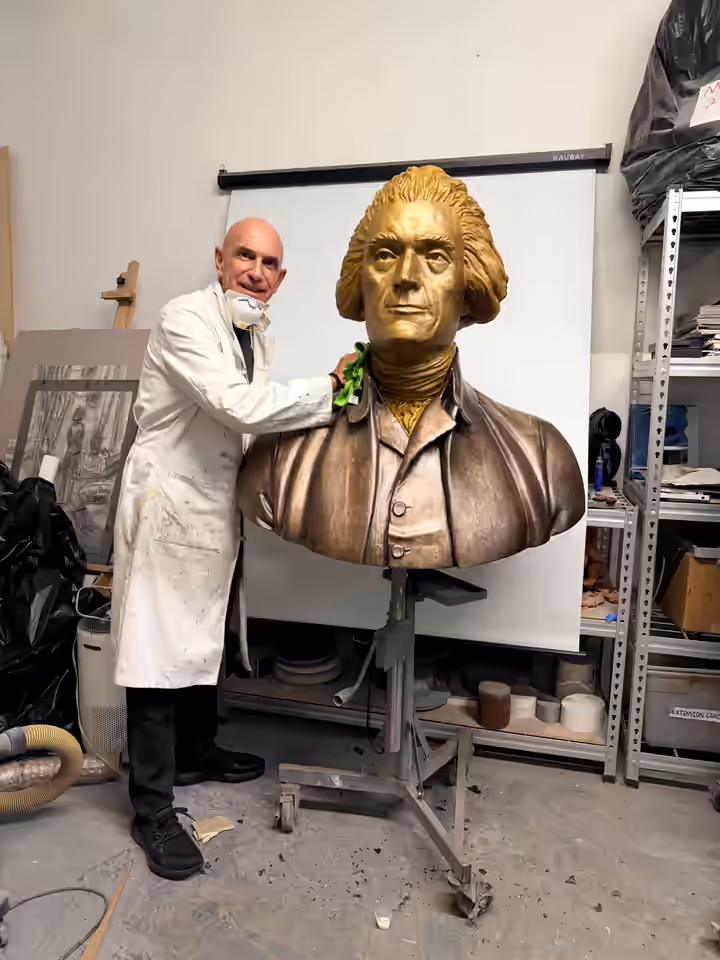 George Petrides with the completed bust of Thomas Jefferson in his New York studio