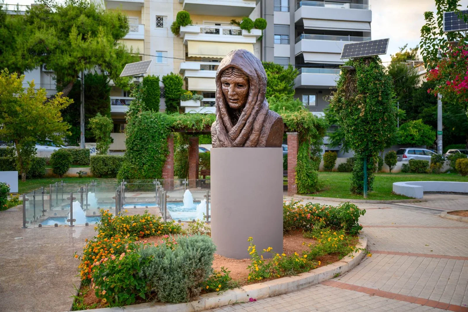 Refugee—Woman of Smyrna on its cylindrical base in Agiou Georgiou Square, Neo Psychiko